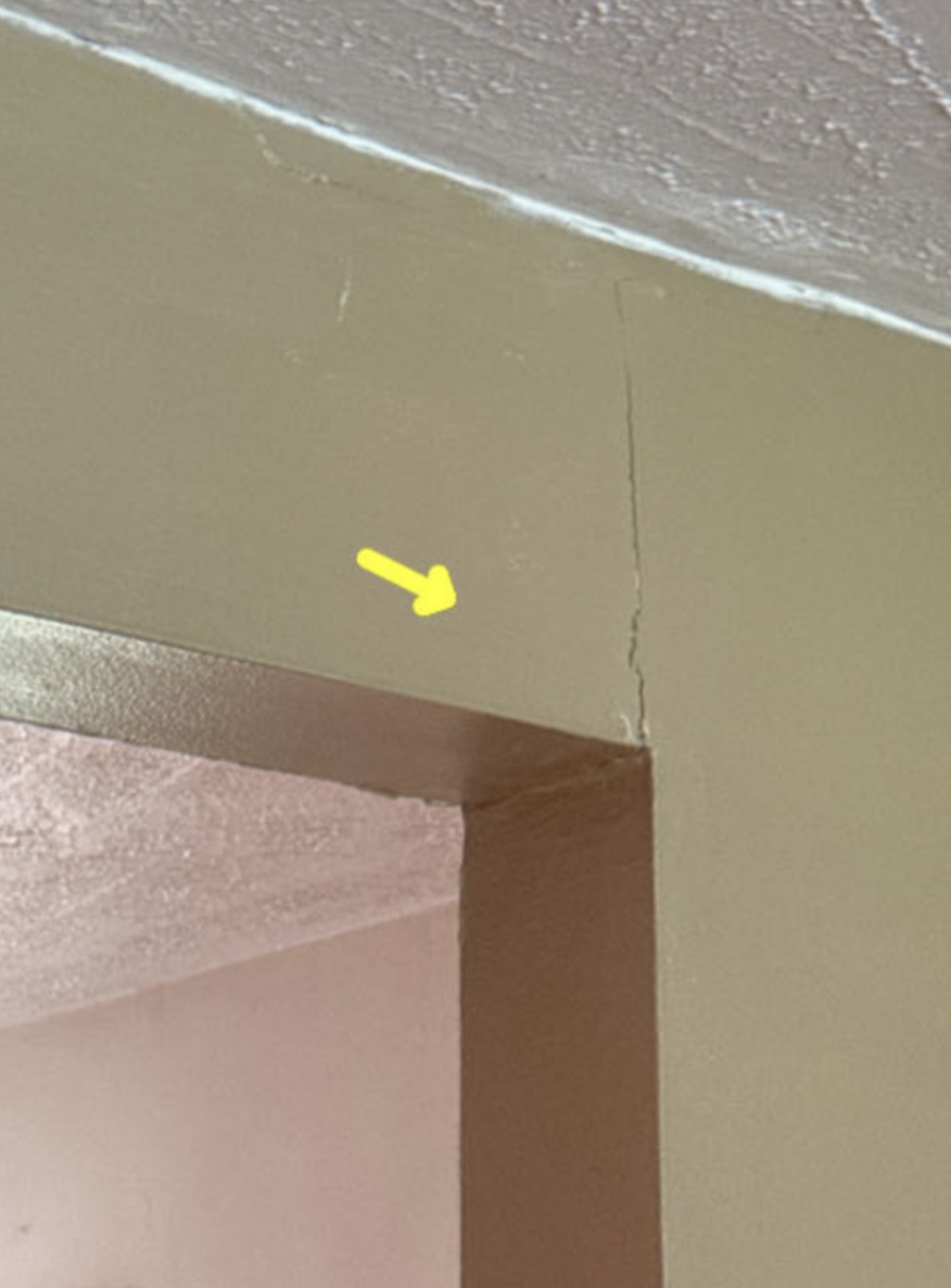 Settlement cracking above doorway