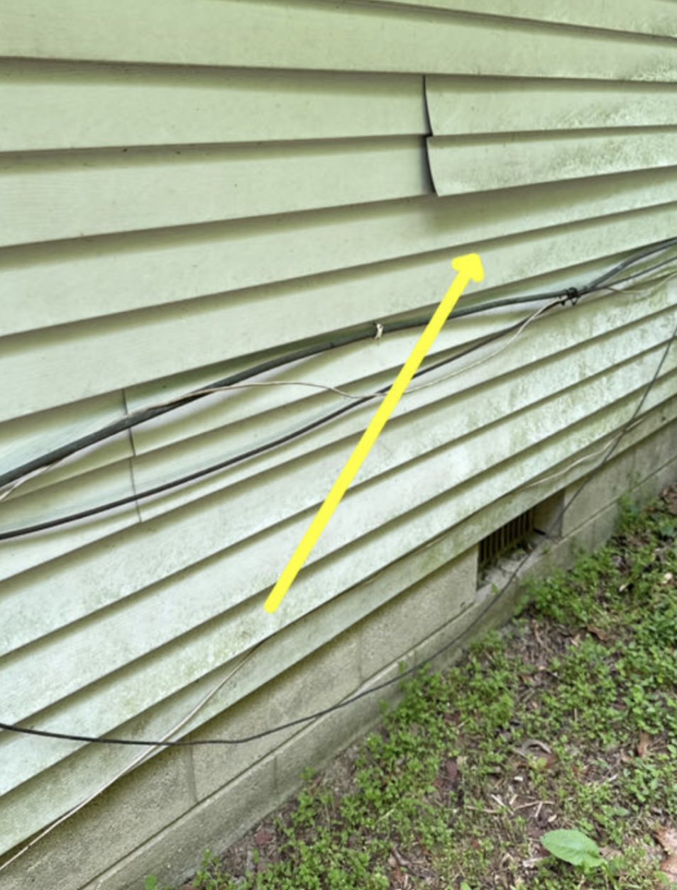 Loose siding and exposed wiring